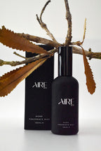Essence Aire & Co home fragrance mist bottle and packaging with branches and leaves on a white background