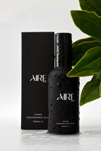 Ocean home fragrance mist bottle by Aire & Co with green leaves. Australian-made coastal room spray