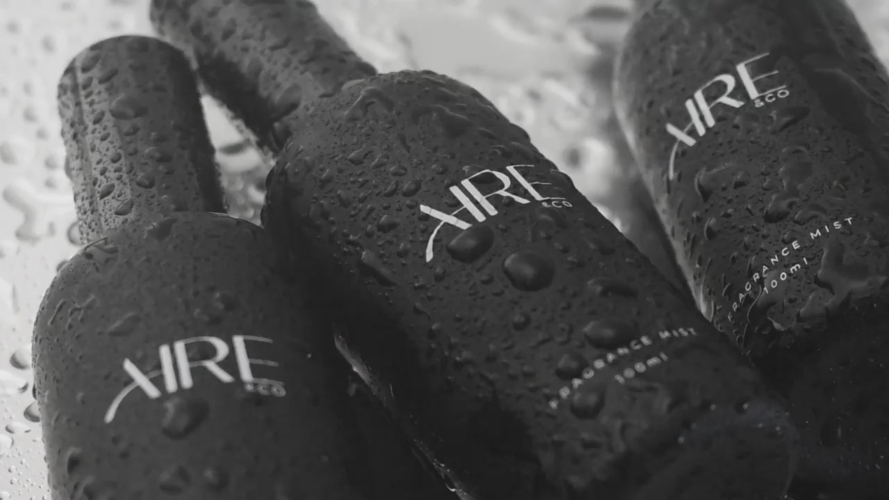 Video showing Aire & Co home fragrance mist bottles being misted with water droplets